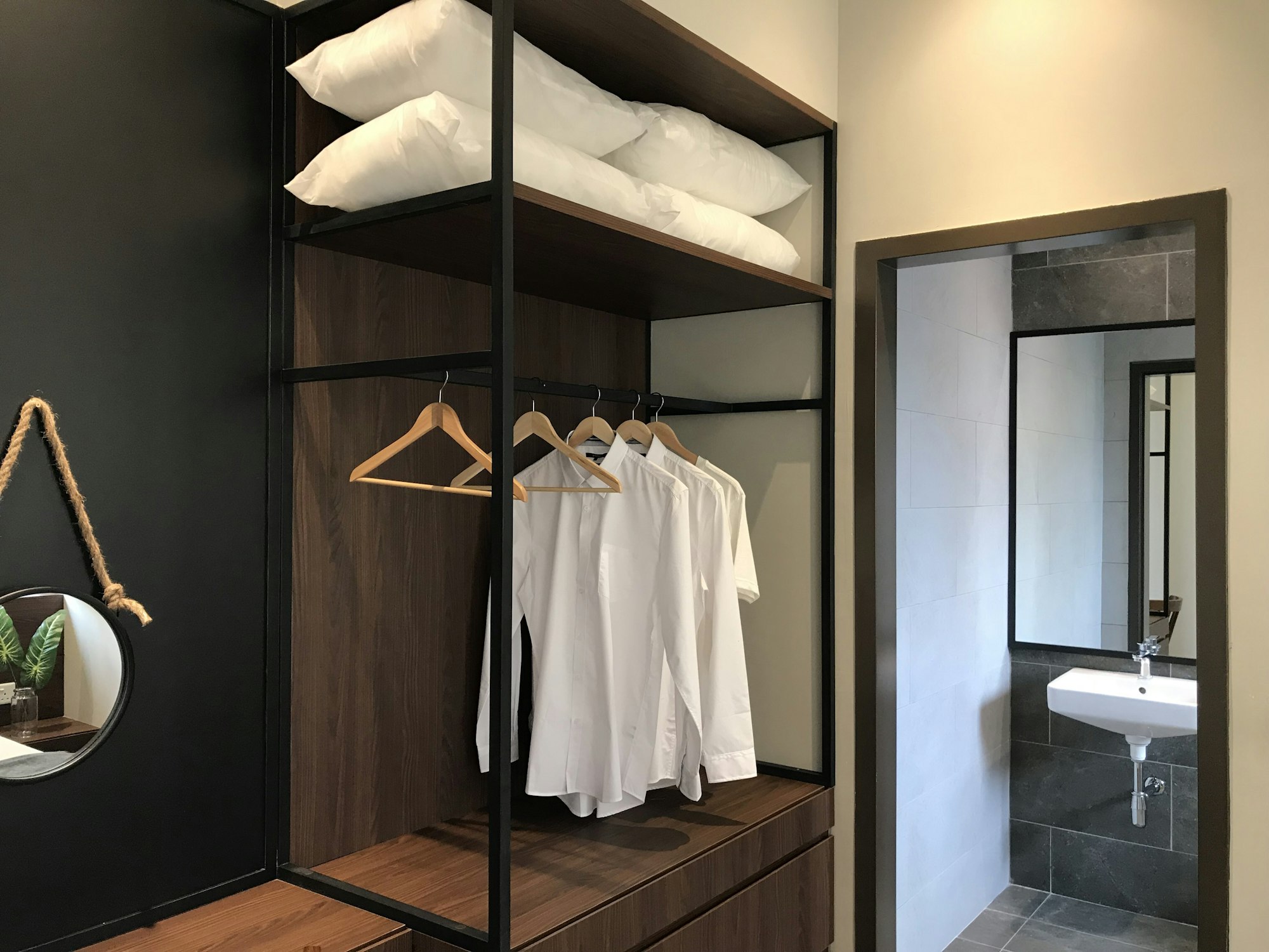 White shirts hanging in a wardrobe